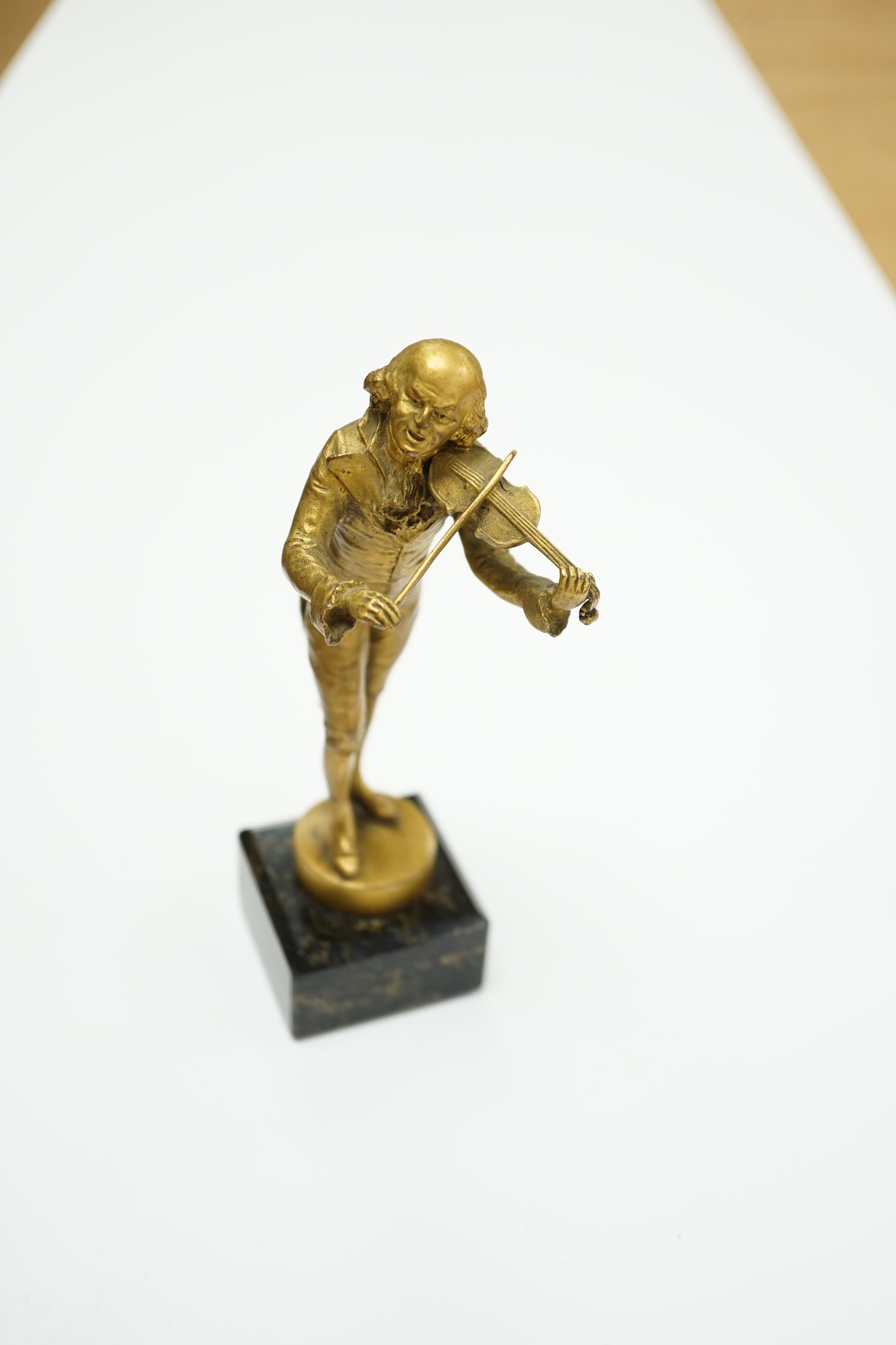 An ormolu bronze of a violinist on a marble base, signed Aktien-Gesellschaft Gladenbeck, Berlin, 14cm high